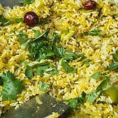 A picture of Rice is Nice Mango and Amla Rice with side dish vegetable Avial.