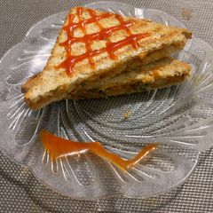 A picture of Crumbled Egg, & veggies sandwich.