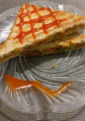 A picture of Crumbled Egg, & veggies sandwich.