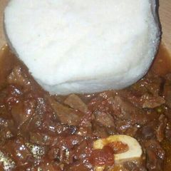 A picture of Ugali with stewed meat.