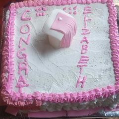 A picture of Vanilla graduation cake#authors marathon.