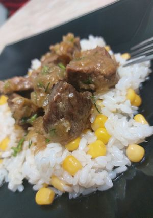 A picture of Steamed beef with delicious rice & corn garnish 🍛.