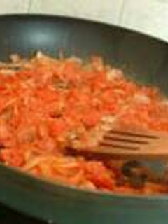 A picture of Scrambled egg with tomatoes.