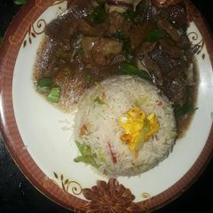 A picture of Chinese rice with beef chilli.