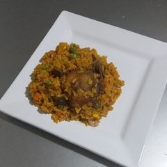 A picture of Jollof Rice and Chicken.