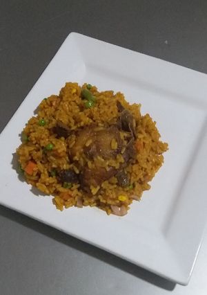 A picture of Jollof Rice and Chicken.