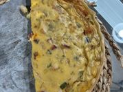 Una foto de tarta de cebolla de verdeo