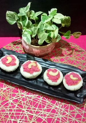 A picture of Beetroot Coconut open Bhapa Pitha.