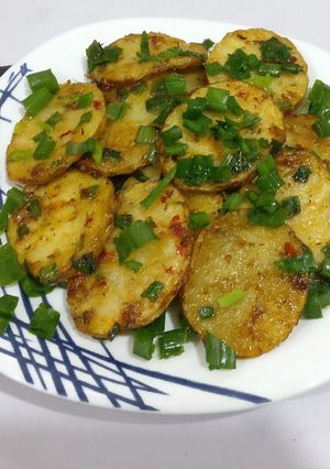 A picture of Potatoes in teriyaki sauce.