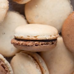 A picture of French Macarons with Chocolate Ganache.