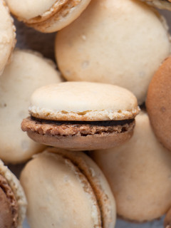 A picture of French Macarons with Chocolate Ganache.