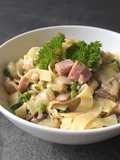 Creamy tagliatelle with ham and belgian endive