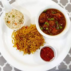 A picture of Chowmin veg manchurian and fried rice.