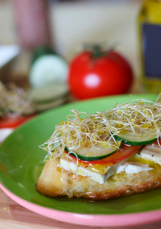A picture of Tofu and salad on toast.