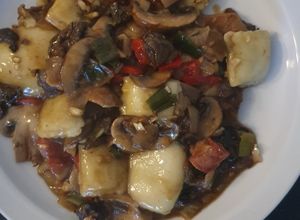 Una foto de Ravioles con Ragout de Hongos