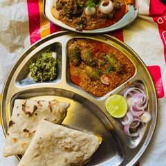 A picture of Stuffed Tondali peanuts masala with jowar bhakri and spicy thecha, in dinner.