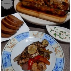 A picture of Baked chicken with Potato and other veggies.