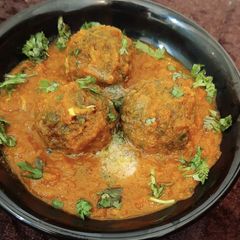A picture of Spinach balls in Gravy.