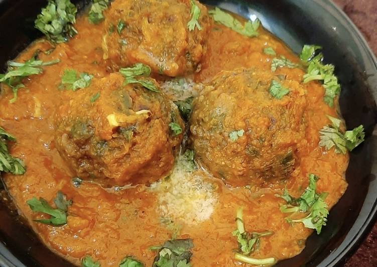 Spinach balls in Gravy