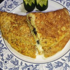 Fluffy Cheese Omelette With Black olives 😋🥚🍽️ A picture of Fluffy Cheese Omelette With Black olives 😋🥚🍽️.