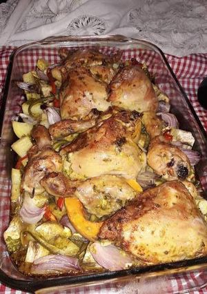 A picture of Oven-Baked Chicken with Potatoes and Vegetables.
