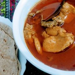 Chicken shorba with roti A picture of Chicken shorba with roti.