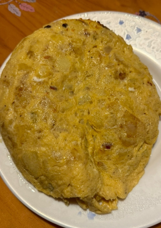 Una foto de Tortilla de patatas con cebolla