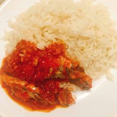 A picture of Coconut rice and sardine sauce.