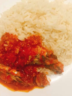 A picture of Coconut rice and sardine sauce.