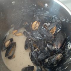 A picture of Mussles with blue cheese sauce.