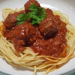 A picture of Spaghetti meatballs in bolognese sauce.
