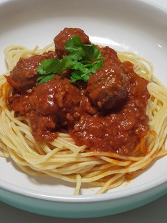 A picture of Spaghetti meatballs in bolognese sauce.