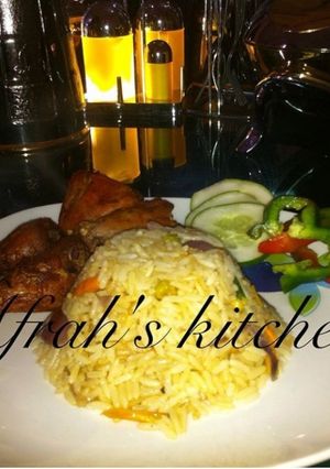 A picture of Jollof rice with fried chicken.