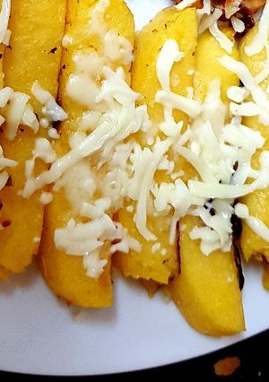A picture of Polenta Chips with mozarella cheese & Italian herbs.