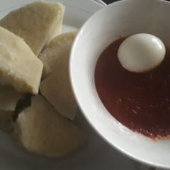 A picture of Boil yam with tomato sauce.
