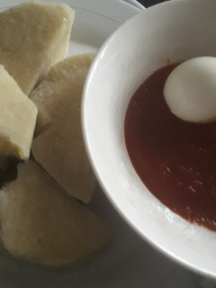 A picture of Boil yam with tomato sauce.