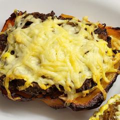A picture of Curried potato filled peppers with cheese.