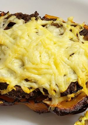 A picture of Curried potato filled peppers with cheese.