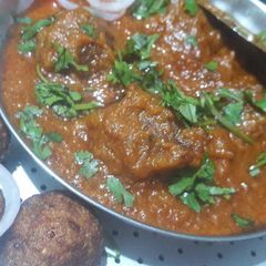 A picture of Louki kofta curry (red gravy).