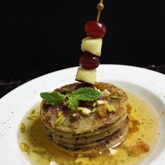 A picture of Apple & Grapes Malpua.