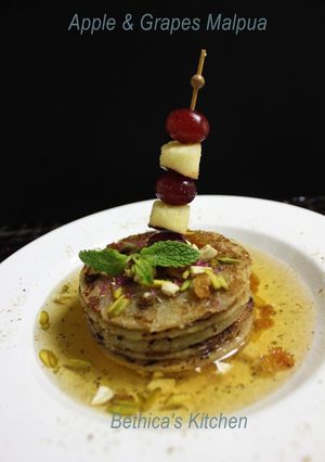 A picture of Apple & Grapes Malpua.