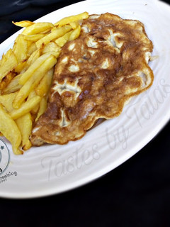 A picture of Chips and omelette.