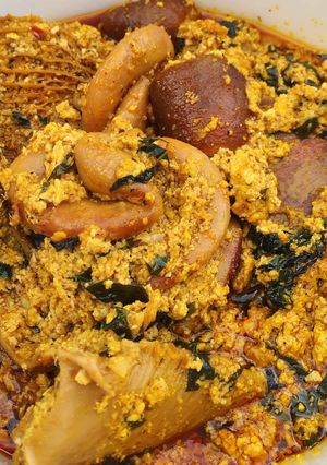 A picture of Egusi soup with vegetable.