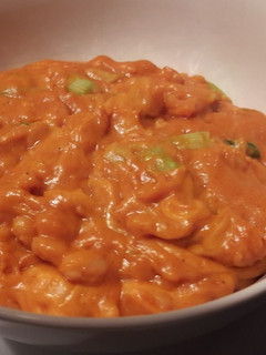 A picture of Cheesy curried baked beans.