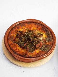 Una foto de Provolone al horno con bacon