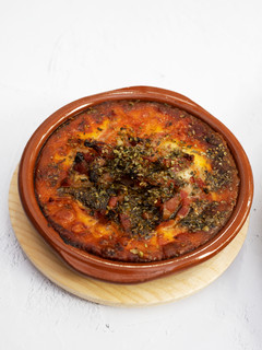 Una foto de Provolone al horno con bacon