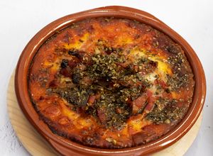 Una foto de Provolone al horno con bacon