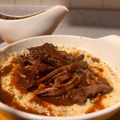 Pot roast with mashed potatoes and gravy A picture of Pot roast with mashed potatoes and gravy.