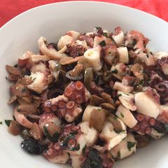 A picture of Octopus and olives salad.