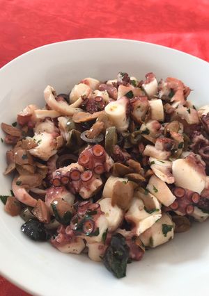 A picture of Octopus and olives salad.